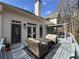 Cozy deck with outdoor seating, fire pit, and charming pergola, perfect for relaxing or entertaining with easy access to the home's interior at 3730 Ashford Ne Pt, Brookhaven, GA 30319