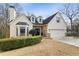 Charming home with stone accents, a bay window, and manicured landscaping at 3730 Ashford Ne Pt, Brookhaven, GA 30319