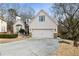 Traditional home with a two-car garage, dormer windows, and a well-maintained lawn at 3730 Ashford Ne Pt, Brookhaven, GA 30319