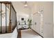 Bright foyer with hardwood floors, a modern chandelier, a large front door and staircase creating a grand entrance at 3730 Ashford Ne Pt, Brookhaven, GA 30319