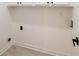 Laundry room with tile flooring, overhead cabinets, and utility connections at 3730 Ashford Ne Pt, Brookhaven, GA 30319