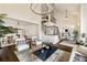 Open concept living room with high ceilings, hardwood floors, and a staircase at 3730 Ashford Ne Pt, Brookhaven, GA 30319