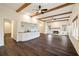 Living room with wood beam ceilings, hardwood floors, and fireplace at 3730 Ashford Ne Pt, Brookhaven, GA 30319