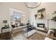Comfortable living room featuring a large window and a fireplace at 3730 Ashford Ne Pt, Brookhaven, GA 30319