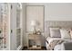 Main bedroom showcasing a decorative lamp, an art piece, and natural light coming from a doorway at 3730 Ashford Ne Pt, Brookhaven, GA 30319