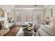 Serene main bedroom with tray ceilings, neutral tones, and access to a private balcony at 3730 Ashford Ne Pt, Brookhaven, GA 30319