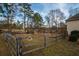 Backyard with a rustic fence, pool, and playset at 5424 Central Church Rd, Douglasville, GA 30135