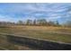 View of pasture with wooden fence in foreground at 5424 Central Church Rd, Douglasville, GA 30135