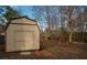 Tan colored storage building in the backyard at 5424 Central Church Rd, Douglasville, GA 30135