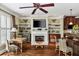 Living room with fireplace, built-in shelving, and hardwood floors at 67 High Top Ln, Atlanta, GA 30328