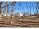 Spacious backyard with trees and wooden fence at 61 Harmony Woods Ln, Dallas, GA 30157