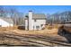 Large backyard with wooden fence and mature trees at 61 Harmony Woods Ln, Dallas, GA 30157