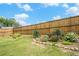 Well-maintained garden area featuring a variety of plants, flowers, and stone borders at 61 Harmony Woods Ln, Dallas, GA 30157
