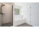 Bright bathroom featuring a tiled shower, soaking tub, and neutral tones at 61 Harmony Woods Ln, Dallas, GA 30157