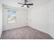 Comfortable bedroom with neutral carpet, window, and fan at 61 Harmony Woods Ln, Dallas, GA 30157