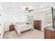 Spacious bedroom with ceiling fan and wood dresser at 61 Harmony Woods Ln, Dallas, GA 30157