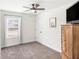 Charming bedroom with ceiling fan, window, and ample closet space at 61 Harmony Woods Ln, Dallas, GA 30157