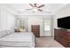 Main bedroom with a ceiling fan and large TV at 61 Harmony Woods Ln, Dallas, GA 30157