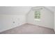 Neutral bonus room features carpet flooring, and window at 61 Harmony Woods Ln, Dallas, GA 30157