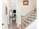 Light and airy entryway with hardwood floors and staircase at 61 Harmony Woods Ln, Dallas, GA 30157