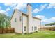Side and backyard view showcasing the home's siding, roof, and landscaped backyard at 61 Harmony Woods Ln, Dallas, GA 30157