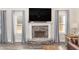 Stone fireplace with a large mantel and built-in shelving at 61 Harmony Woods Ln, Dallas, GA 30157