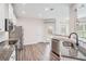 Bright kitchen featuring granite countertops, stainless steel appliances, and hardwood floors at 61 Harmony Woods Ln, Dallas, GA 30157