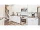 Bright kitchen with white cabinets and stainless steel appliances at 61 Harmony Woods Ln, Dallas, GA 30157