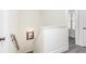 Upper hallway with simple wooden railing and mirror at 61 Harmony Woods Ln, Dallas, GA 30157