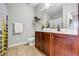 This bathroom features a vanity with storage and a shower with bright yellow accents at 401 16Th Nw St # 1376, Atlanta, GA 30363