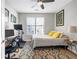 Comfortable bedroom featuring a ceiling fan, natural light, and dedicated workspace at 401 16Th Nw St # 1376, Atlanta, GA 30363