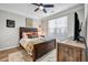 Cozy bedroom featuring a large window, a comfortable bed, and stylish wooden furniture at 401 16Th Nw St # 1376, Atlanta, GA 30363