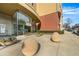 Modern building entrance featuring sleek glass facade and contemporary landscaping with decorative planters and stone features at 401 16Th Nw St # 1376, Atlanta, GA 30363