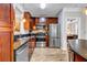 This modern kitchen offers stainless steel appliances, stone countertops, and wood floors at 401 16Th Nw St # 1376, Atlanta, GA 30363