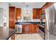 Well-equipped kitchen boasts stainless steel appliances, granite countertops, and stylish wood cabinetry at 401 16Th Nw St # 1376, Atlanta, GA 30363