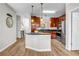 Stylish kitchen featuring a center island, stainless steel appliances, and sleek countertops, with modern lighting fixtures at 401 16Th Nw St # 1376, Atlanta, GA 30363