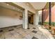 Welcoming building lobby features tiled floors, stone columns, and a glass encased outdoor space at 401 16Th Nw St # 1376, Atlanta, GA 30363