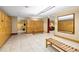 A spacious locker room with bright tile flooring and wooden benches at 401 16Th Nw St # 1376, Atlanta, GA 30363