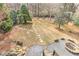 Large backyard with a stone path and a stone fire pit perfect for outdoor entertaining at 4478 Outpost Ct, Roswell, GA 30075
