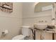 Stylish powder room with decorative vessel sink and stylish wall paneling at 4478 Outpost Ct, Roswell, GA 30075