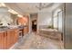 Luxurious bathroom with dual vanities, soaking tub, walk-in shower, and tile flooring at 4478 Outpost Ct, Roswell, GA 30075