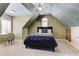 Unique bedroom with an attic ceiling, neutral carpet, and exposed brick adding character and charm at 4478 Outpost Ct, Roswell, GA 30075