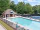 Beautiful community pool, perfect for relaxation, with lounge chairs and nearby tennis courts at 4478 Outpost Ct, Roswell, GA 30075
