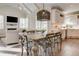 Open concept dining room with vaulted ceilings and view to the kitchen and living room at 4478 Outpost Ct, Roswell, GA 30075