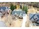 An aerial view shows the well-maintained lawn and landscaping of this elegant home with a winding walkway and spacious driveway at 4478 Outpost Ct, Roswell, GA 30075
