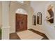 Welcoming foyer with dark wood flooring, arched doorway, and stylish decorative elements at 4478 Outpost Ct, Roswell, GA 30075