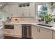 Updated kitchen featuring white cabinets, stainless steel appliances, and granite countertops at 4478 Outpost Ct, Roswell, GA 30075