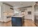 Modern kitchen with a large island, stainless steel appliances, and stylish cabinets at 4478 Outpost Ct, Roswell, GA 30075