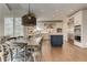 Eat-in kitchen boasts stainless appliances, a stylish island, and hardwood floors at 4478 Outpost Ct, Roswell, GA 30075