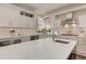 Open concept kitchen with white cabinets, stainless appliances, and granite countertops at 4478 Outpost Ct, Roswell, GA 30075